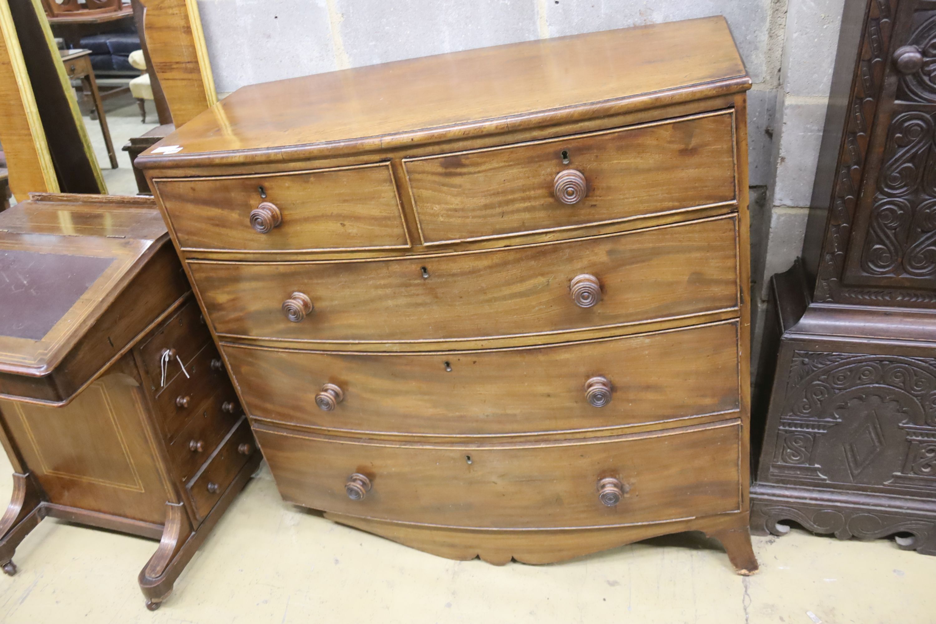 An early Victorian mahogany bow front chest (in need of restoration), width 108cm, depth 52cm, height 99cm